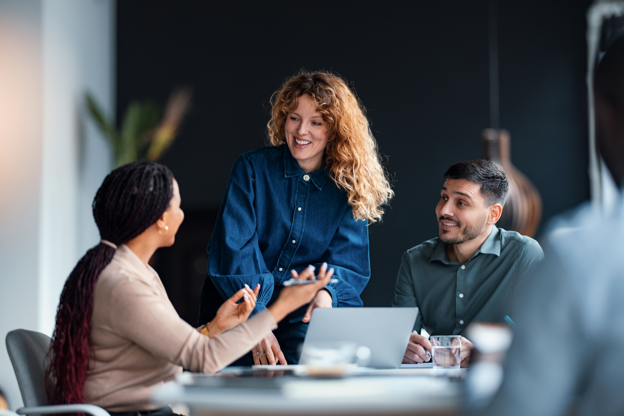 Business Professionals Collaborating During a Corporate Meeting in a Modern Office
